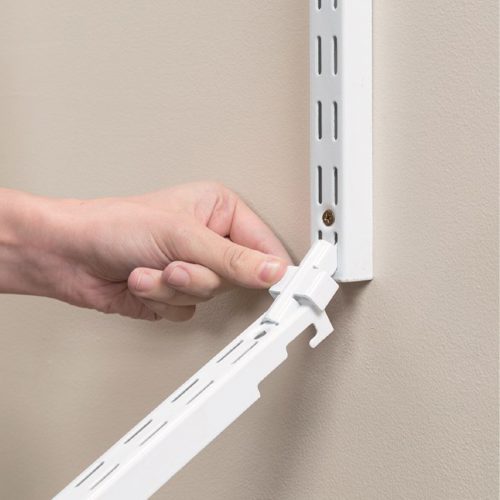 Flexi Storage Home Solutions Double Slot Wall Strip Joiners White being installed on wall to join Double Slot Wall Strips