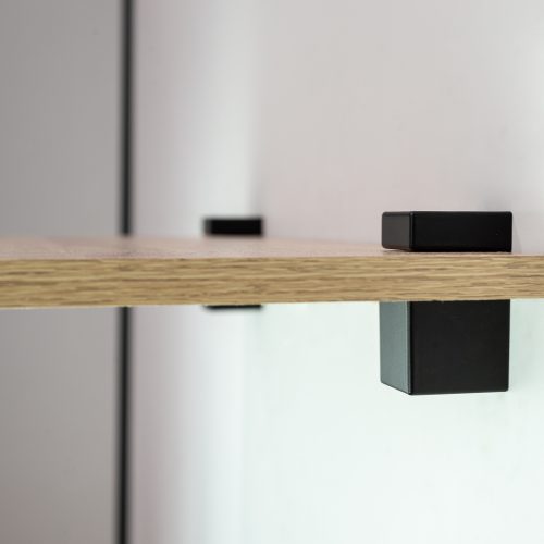 Flexi Storage Decorative Shelving Cube Shelf Clip Matt Black 2 Pack installed onto wall and supporting a timber shelf - side view
